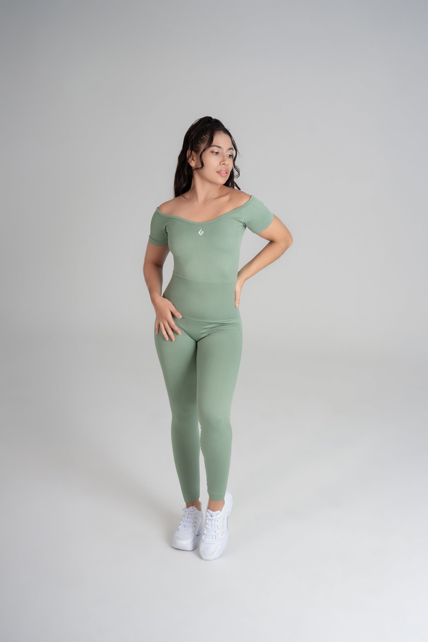 VELO seamless green jumpsuit front view sculpting activewear